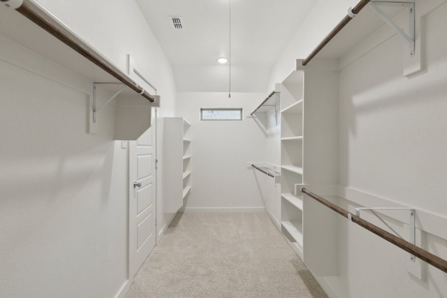 Primary Closet in the Harrison home plan by Trophy Signature Homes – REPRESENTATIVE PHOTO