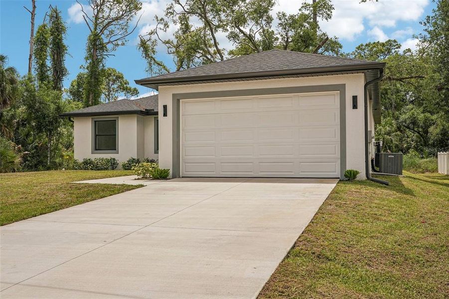 Front exterior of a new home in , Port Charlotte, FL, highlighting curb appeal (Image 20).
