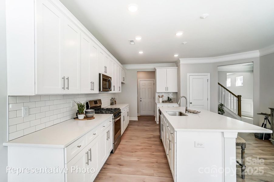 This home will feature gray quartz counters, white cabinets and black hardware.