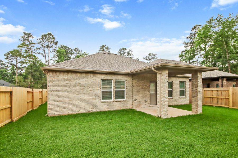 Exterior details and patio area of a home in The Woodlands Hills, Willis (Image 4). Exterior details and patio area of a home in The Woodlands Hills, Willis (Image 4).