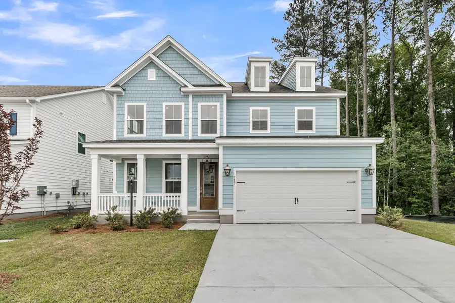 Front exterior of a new home in Tidewater at Lakes of Cane Bay, Summerville, SC, highlighting curb appeal (Image 1). Front exterior of a new home in Tidewater at Lakes of Cane Bay, Summerville, SC, highlighting curb appeal (Image 1).