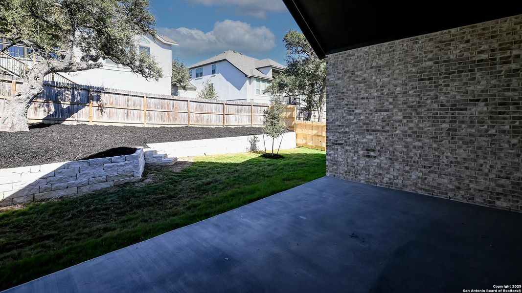 Exterior details and patio area of a home in Kinder Ranch 70', San Antonio (Image 3). Exterior details and patio area of a home in Kinder Ranch 70', San Antonio (Image 3).