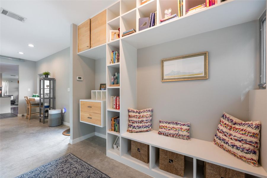 Built-in shelving and bench seating create a versatile, inviting entryway. Built-in shelving and bench seating create a versatile, inviting entryway.