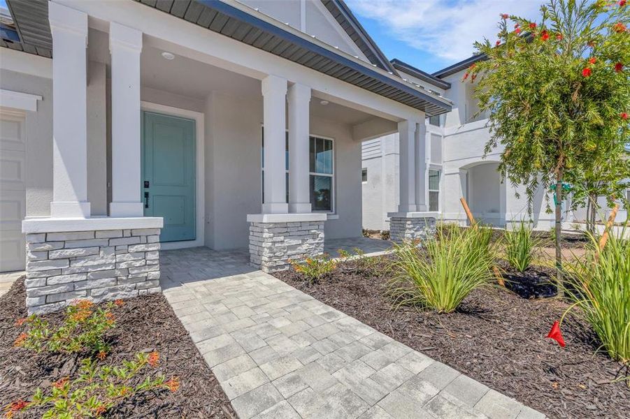 Exterior details and patio area of a home in Creeks Edge at Twin Rivers, Parrish (Image 27).