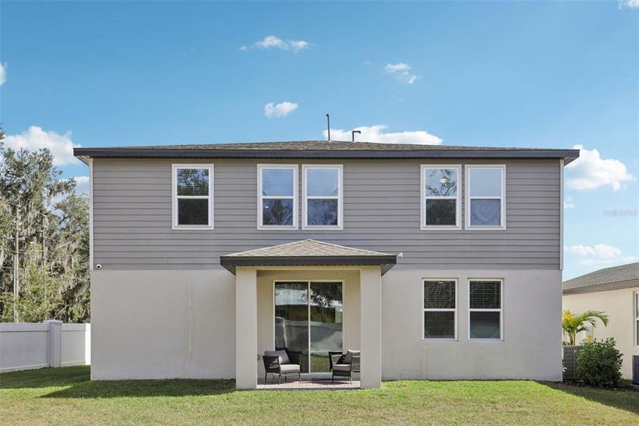 Exterior details and patio area of a home in Fox Pointe at Rivers Edge, Leesburg (Image 29).