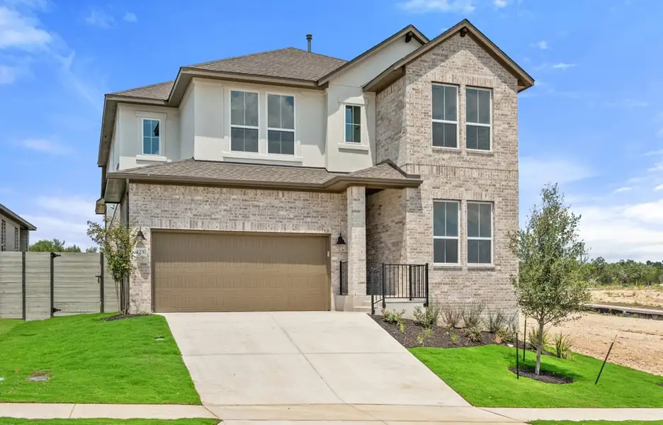 Front exterior of a new home in Arbor Collection At Wolf Ranch, Georgetown, TX, highlighting curb appeal (Image 1).
