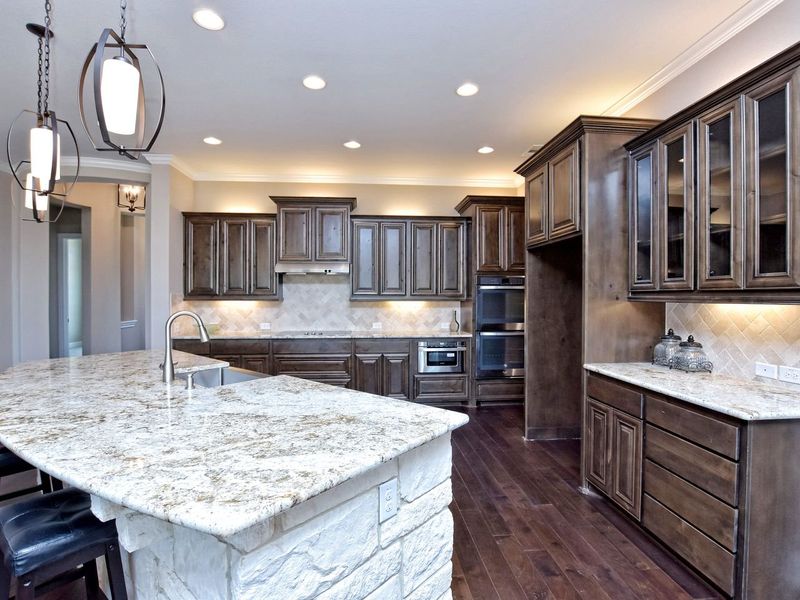 Representative furnished interior of a home built from the San Simeon I by Giddens Homes in Clearwater Ranch, Liberty Hill (Image 261).