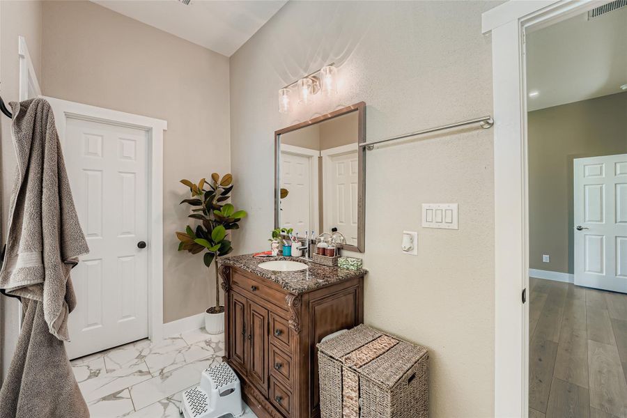 Bathroom with vanity and baseboards Bathroom with vanity and baseboards
