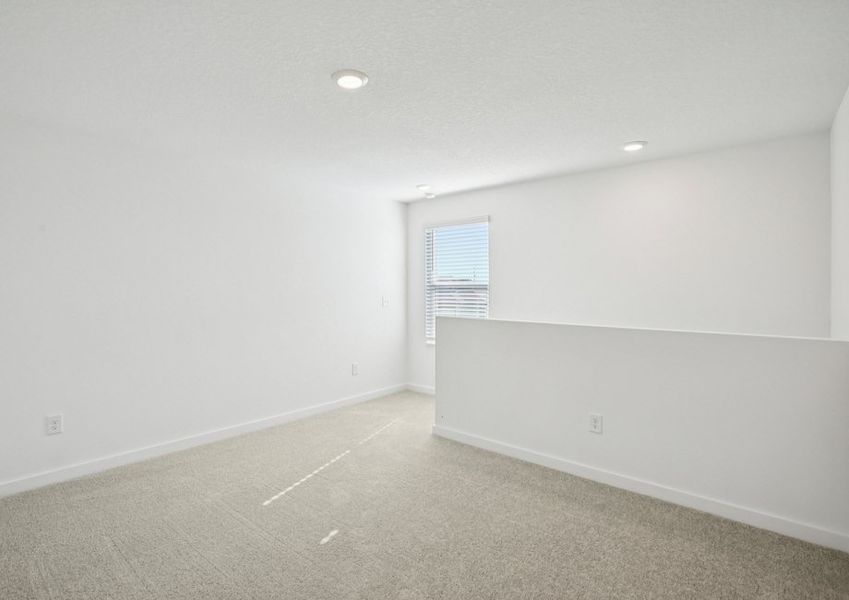 Set up a tv and couch in the upstairs game room Set up a tv and couch in the upstairs game room