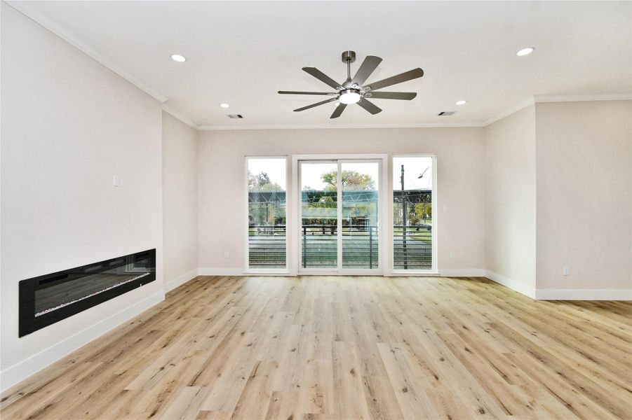 2nd floor-Living area with modern fireplace and park view 2nd floor-Living area with modern fireplace and park view