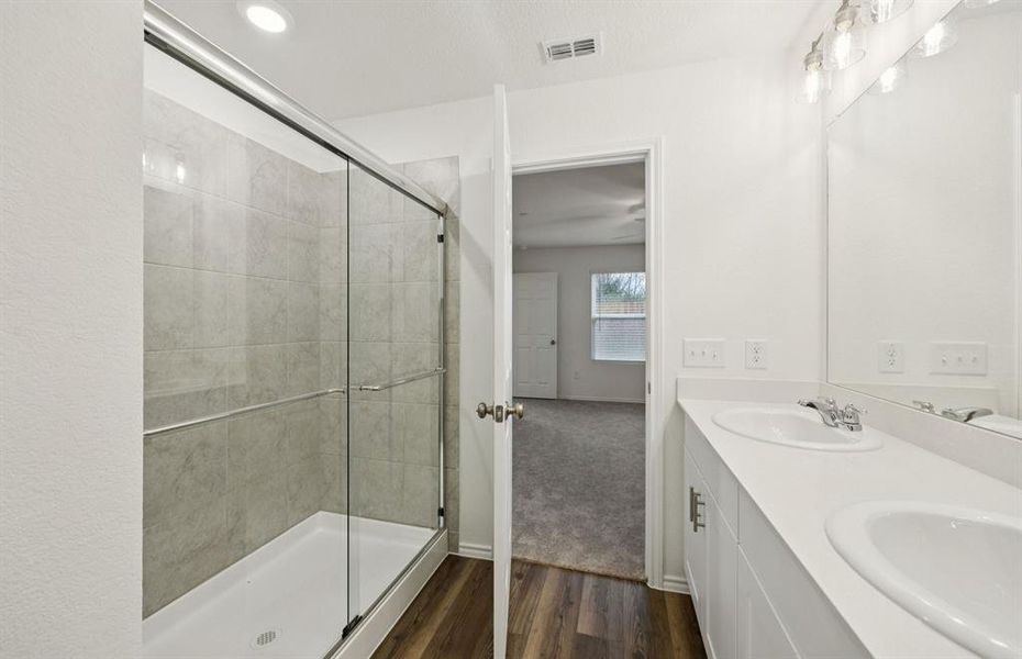 Owner's bath featuring a walk-in shower Owner's bath featuring a walk-in shower