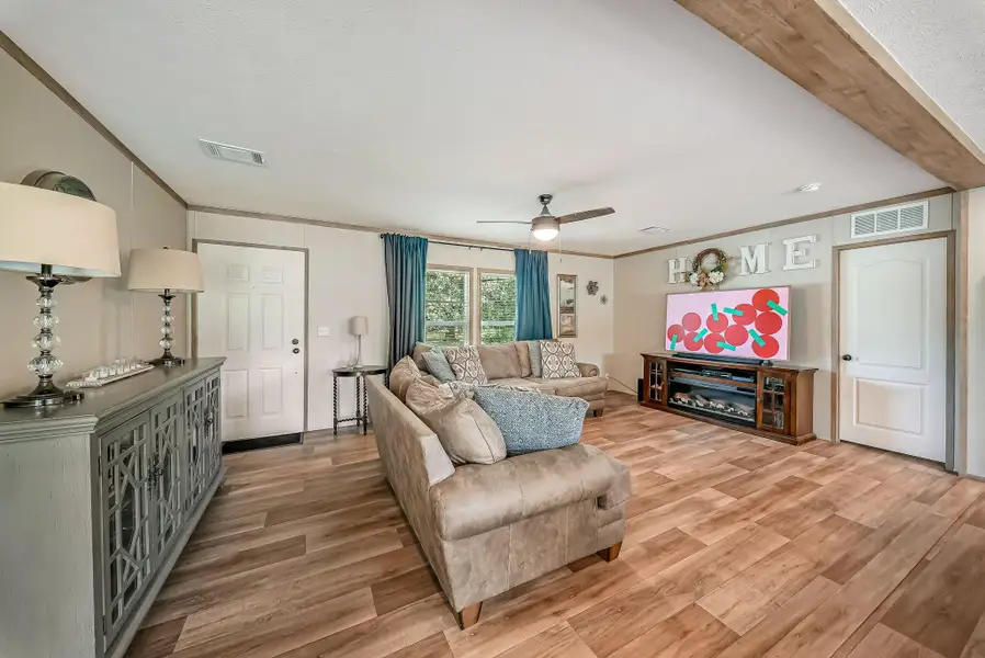 Spacious Family/Living Room with Vinyl Flooring throughout the home.
