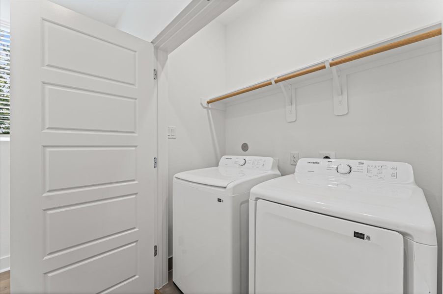 Conveniently located on the second floor, this well-appointed laundry room offers easy access from nearby bedrooms—streamlining daily routines and eliminating the need to carry laundry up and down stairs.