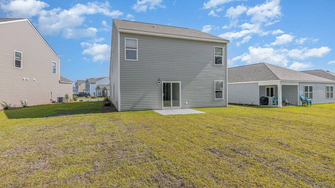 Representative exterior photo of a completed home built from the WREN by D.R. Horton in Cedar Hill Landing, Navassa, NC (Image 17).