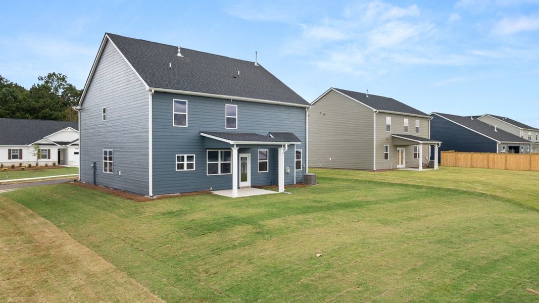 Exterior details and patio area of a home in Preserve at Dove Creek, Statham (Image 18).