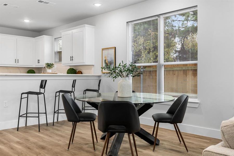 Dining space featuring light hardwood / wood-style flooring