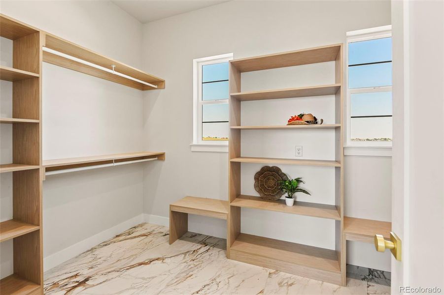 Primary bedroom walk in closet