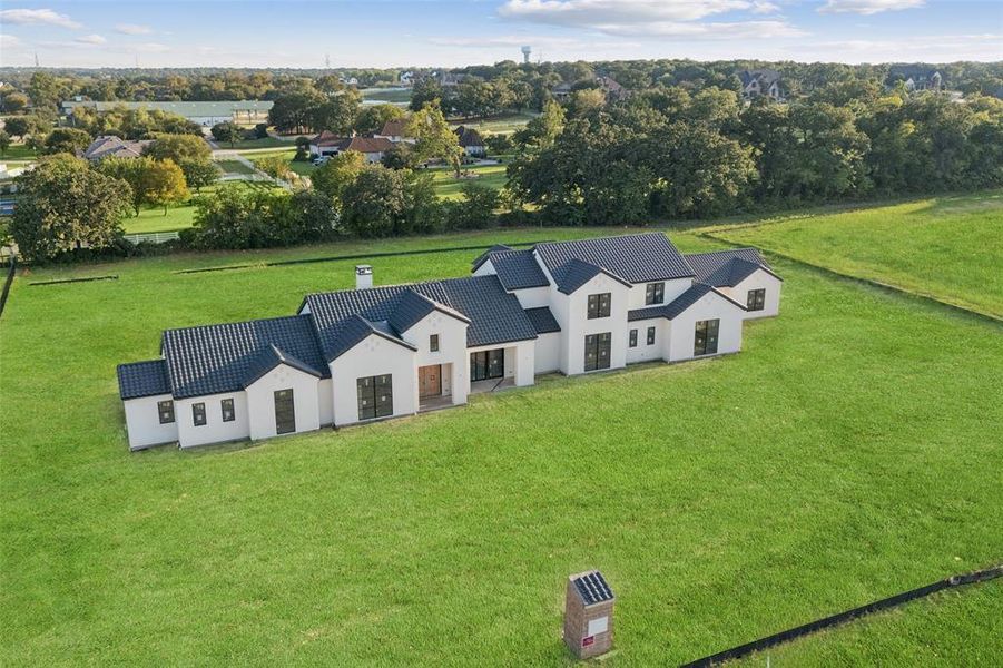 Front exterior of a new home in , Bartonville, TX, highlighting curb appeal (Image 2). Front exterior of a new home in , Bartonville, TX, highlighting curb appeal (Image 2).