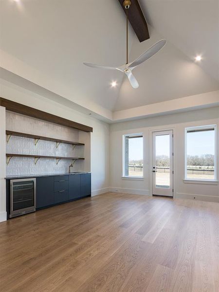 The Activity Room is ready for fun with a bar - sink and under counter refrigerator - and lots of cabinets for games and shelves for your collectibles!