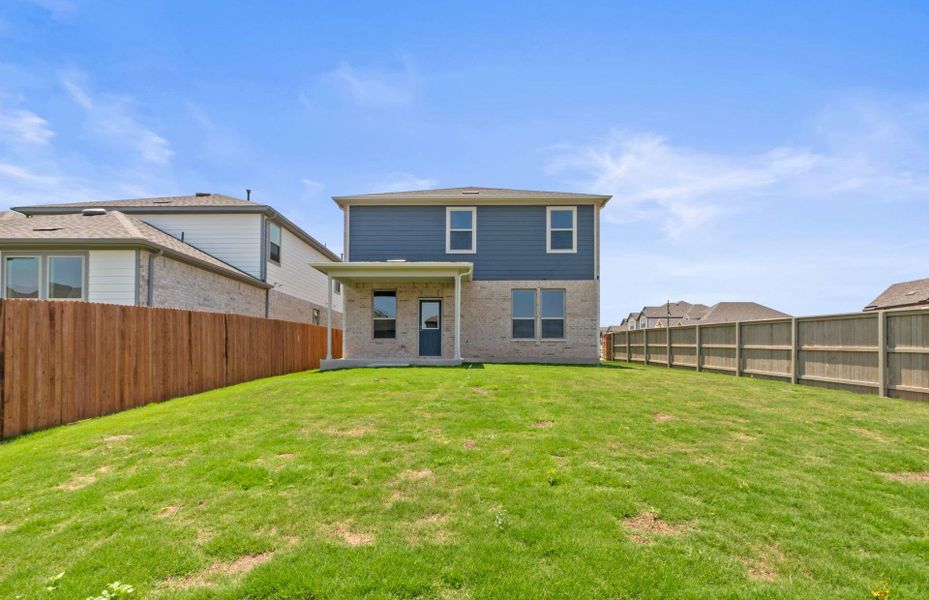 Front exterior of a new home in Saddleback at Santa Rita Ranch, Liberty Hill, TX, highlighting curb appeal (Image 2).