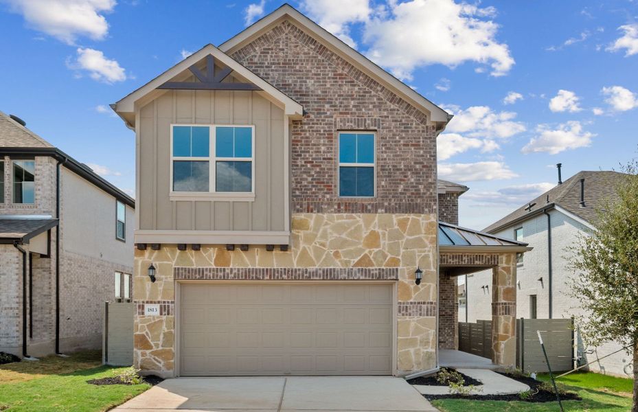 Front exterior of a new home in Wolf Ranch, Georgetown, TX, highlighting curb appeal (Image 20).