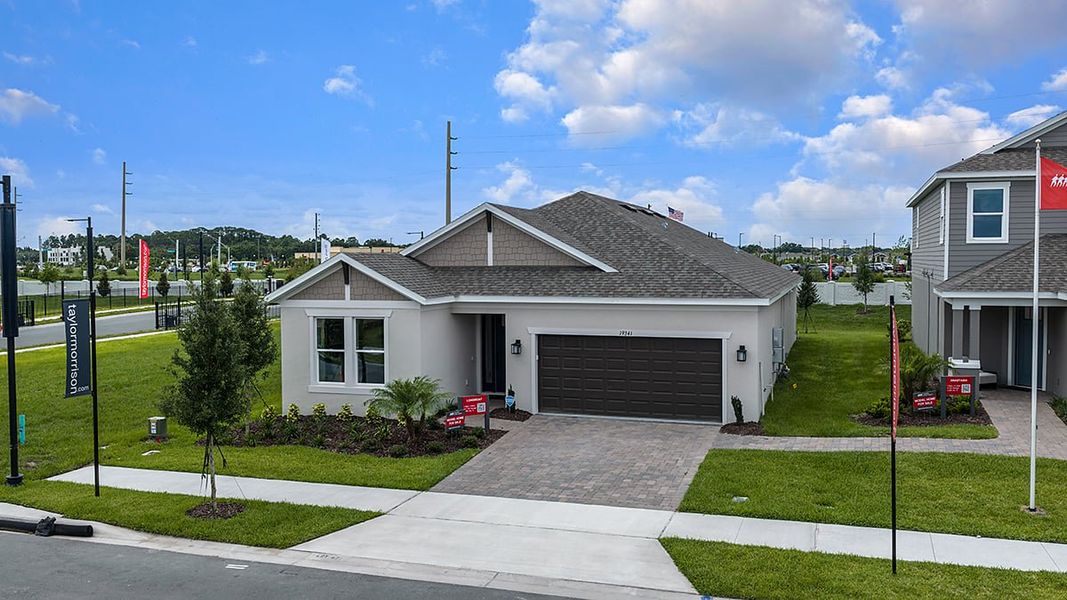 Front exterior of a new home in Lochside, Mount Dora, FL, highlighting curb appeal (Image 23).