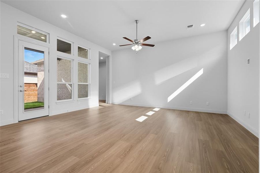 Spare room featuring recessed lighting, light wood-type flooring, and ceiling fan