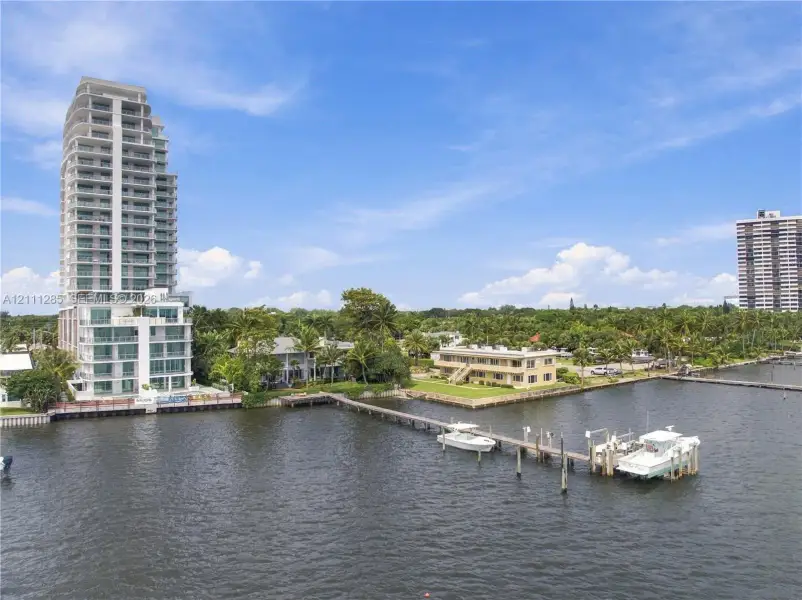 Waterfront residential site featuring a private deep-water dock and bulkhead along an inlet Waterfront residential site featuring a private deep-water dock and bulkhead along an inlet