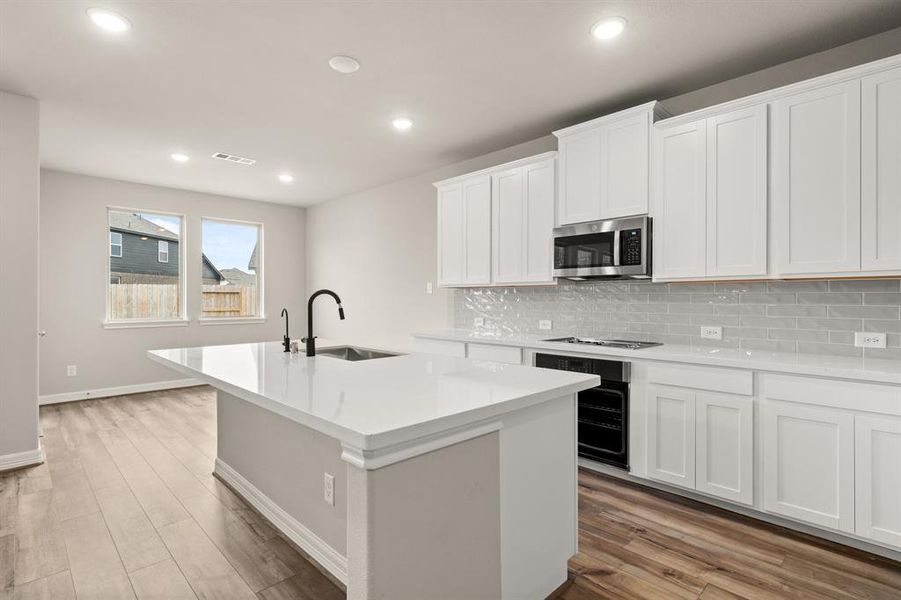 This kitchen is not only a functional space but also has ample storage. Whether you're a seasoned chef or just love to gather and enjoy good food, this kitchen is a dream come true.