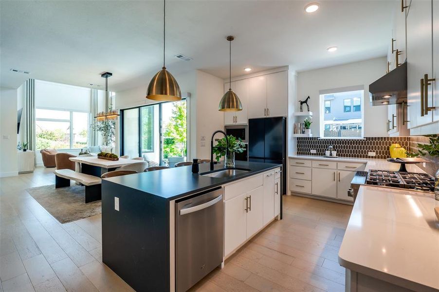 Another view of the kitchen to dining and living room areas...note all of the natural light.
