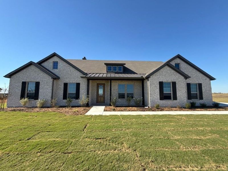 Front exterior of a new home in Clear Sky Addition, Valley View, TX, highlighting curb appeal (Image 1).
