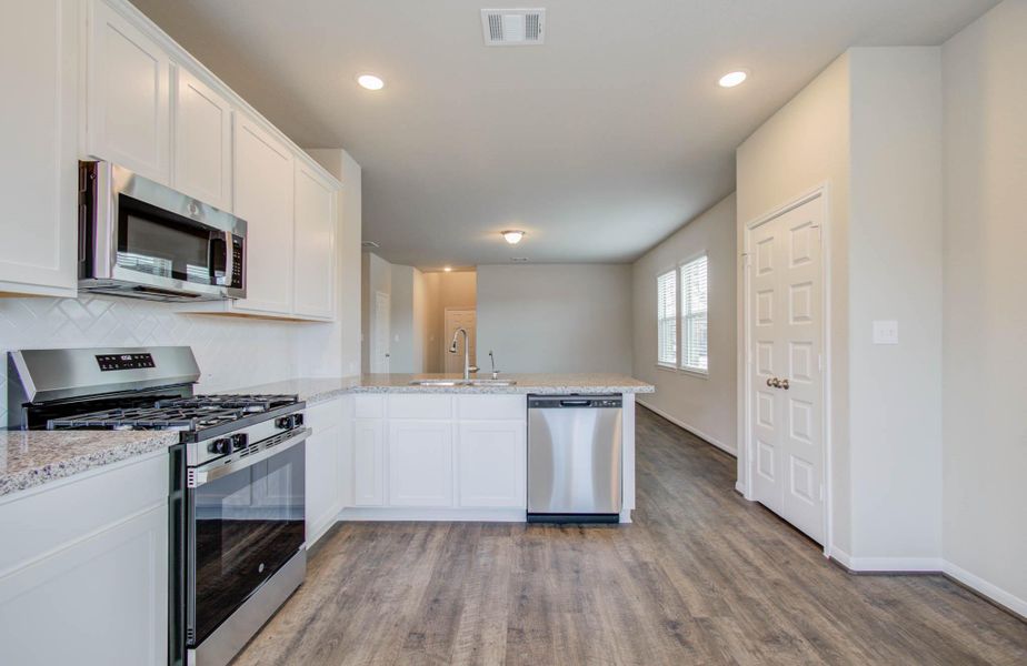 Furnished interior view inside a new home in Legends Bay, Baytown (Image 6).