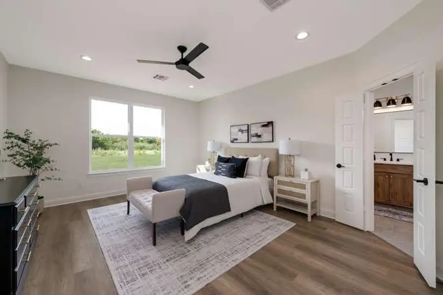 Bedroom featuring ceiling fan, dark wood finished floors, recessed lighting, and connected bathroom Bedroom featuring ceiling fan, dark wood finished floors, recessed lighting, and connected bathroom