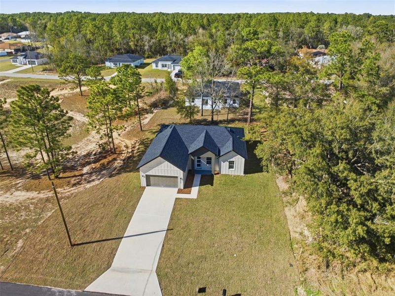 Front exterior of a new home in , Citrus Springs, FL, highlighting curb appeal (Image 19).