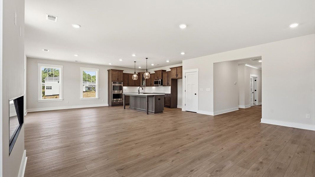 Spacious family room with accomplished design and eye-catching details throughout by DRB Homes