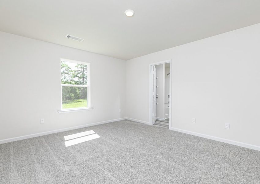 Rest and relaxation await in the master bedroom
