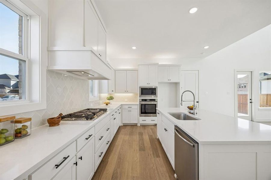 Beautiful cabinetry, gorgeous counter tops and stylish backsplash effortlessly pair with contemporary stainless steel create a dream kitchen for the ages!