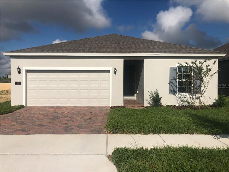 Front exterior of a new home in Seaport Village, Tavares, FL, highlighting curb appeal (Image 1). Front exterior of a new home in Seaport Village, Tavares, FL, highlighting curb appeal (Image 1).