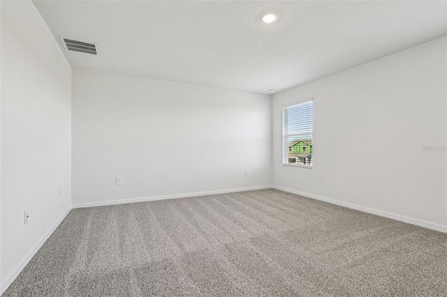 Spacious, unfurnished interior of a new home in Lake Deer Estates - Signature Series, Poinciana (Image 28).