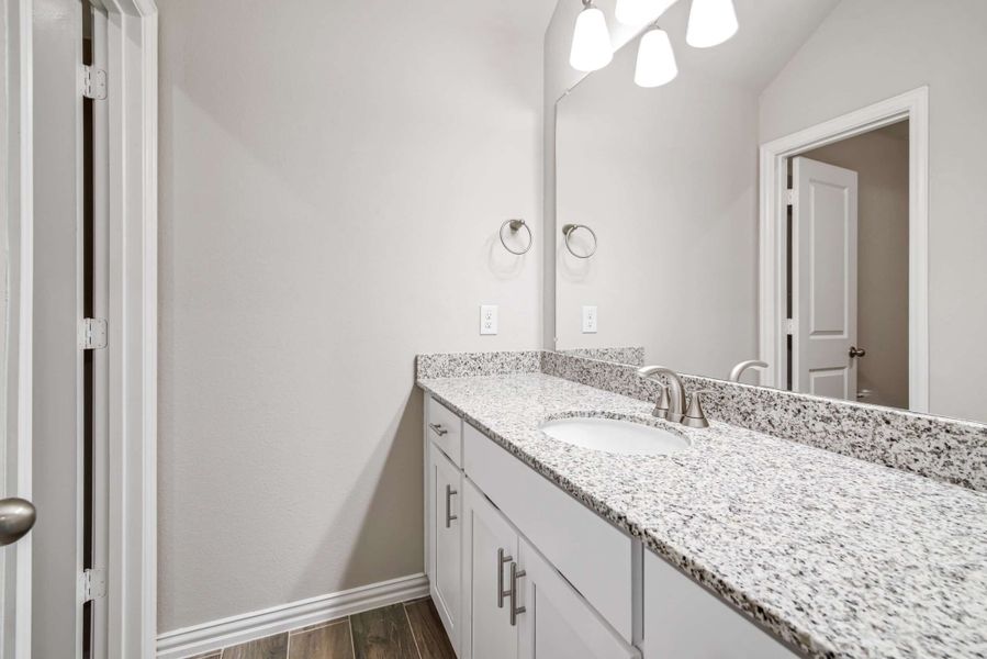 Representative furnished interior of a home built from the The Tulip by Lillian Custom Homes in The Preserve, Sherman (Image 10).
