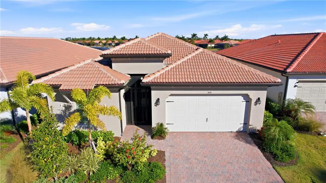 Front exterior of a new home in , Nokomis, FL, highlighting curb appeal (Image 25). Front exterior of a new home in , Nokomis, FL, highlighting curb appeal (Image 25).