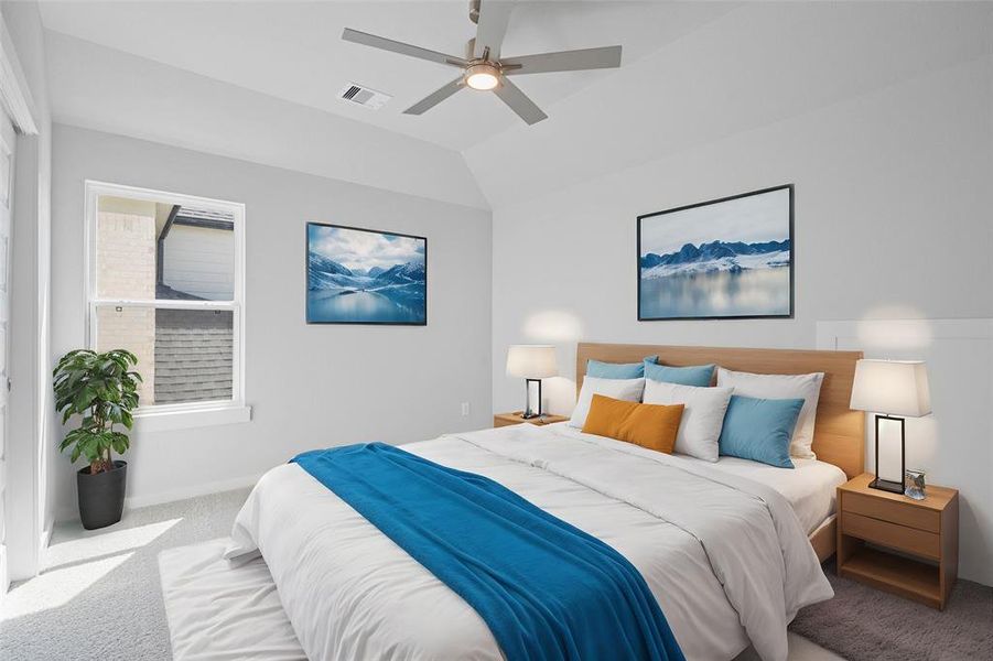 Secondary bedroom features plush carpet, custom paint, ceiling fan with lighting and a large window with privacy blinds.