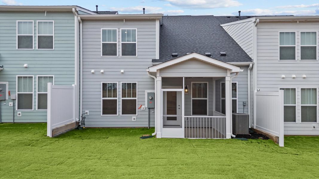 Exclusive rear screened porch with accomplished detail and elevated outdoor living potential
