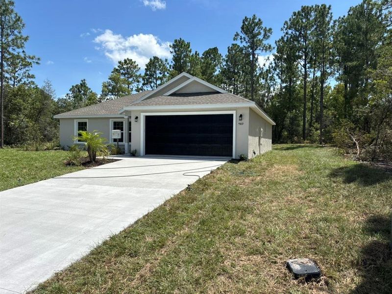 Front exterior of a new home in , Dunnellon, FL, highlighting curb appeal (Image 2). Front exterior of a new home in , Dunnellon, FL, highlighting curb appeal (Image 2).