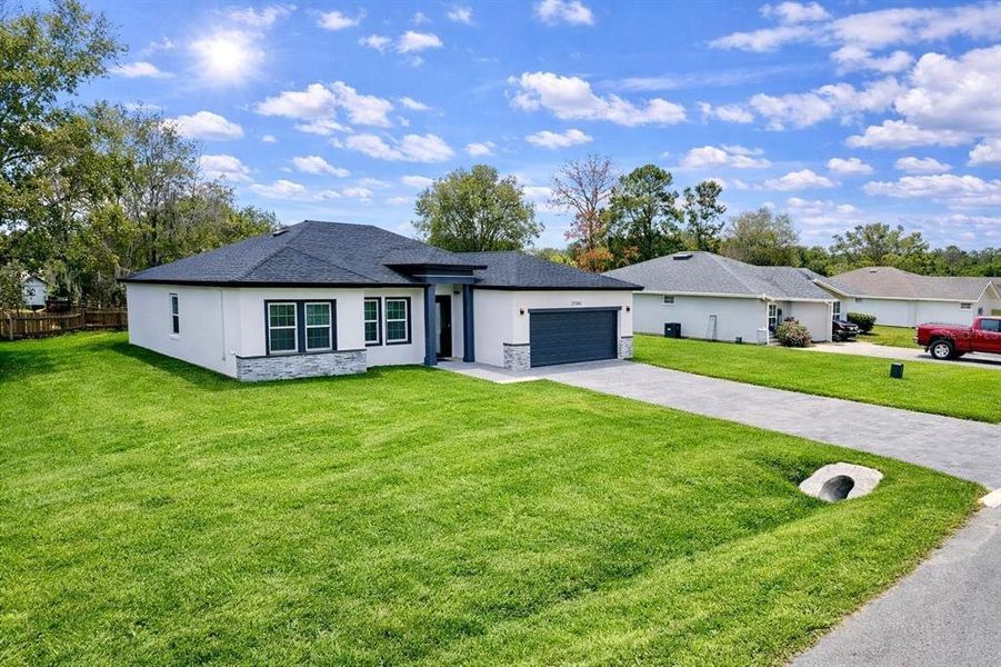 Front exterior of a new home in , Ocala, FL, highlighting curb appeal (Image 20).