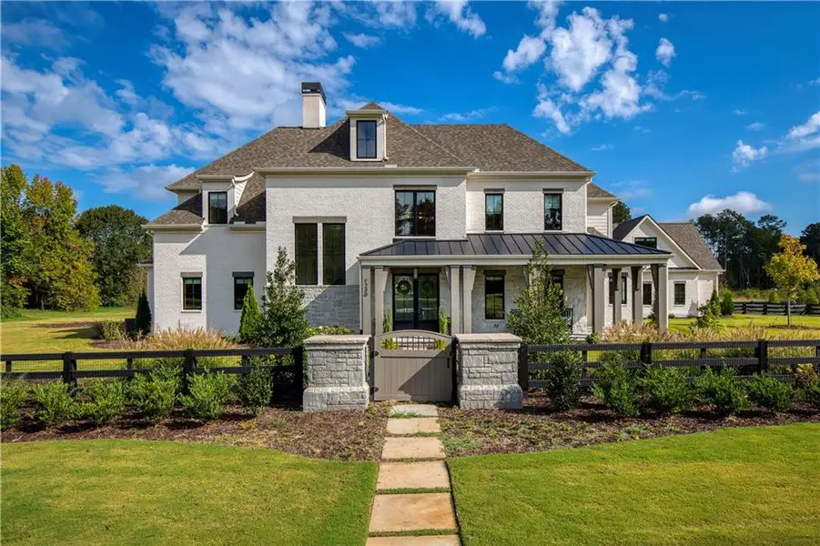 Front exterior of a new home in , Alpharetta, GA, highlighting curb appeal (Image 2). Front exterior of a new home in , Alpharetta, GA, highlighting curb appeal (Image 2).