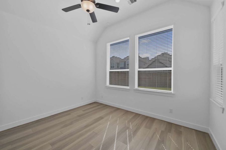 Representative unfurnished interior of a home built from the Versailles by Chesmar Homes in Meridiana Chateau, Manvel (Image 24).
