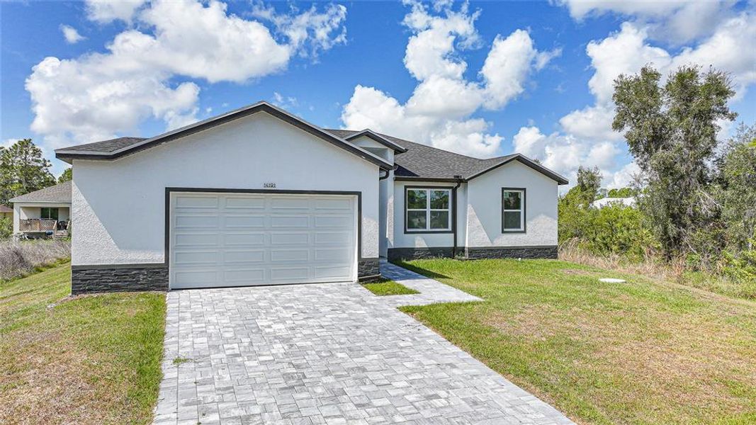 Front exterior of a new home in , Port Charlotte, FL, highlighting curb appeal (Image 23).