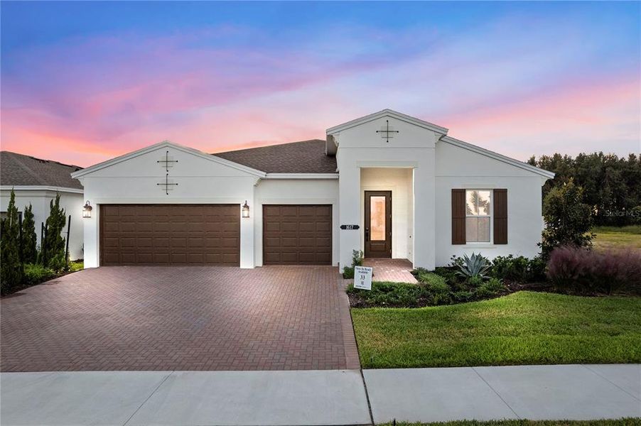 Front exterior of a new home in Cresswind at Lake Harris, Tavares, FL, highlighting curb appeal (Image 2). Front exterior of a new home in Cresswind at Lake Harris, Tavares, FL, highlighting curb appeal (Image 2).