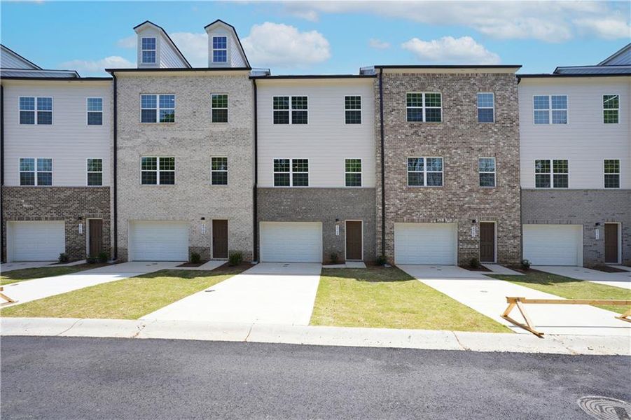 Front exterior of a new home in , Stone Mountain, GA, highlighting curb appeal (Image 1).